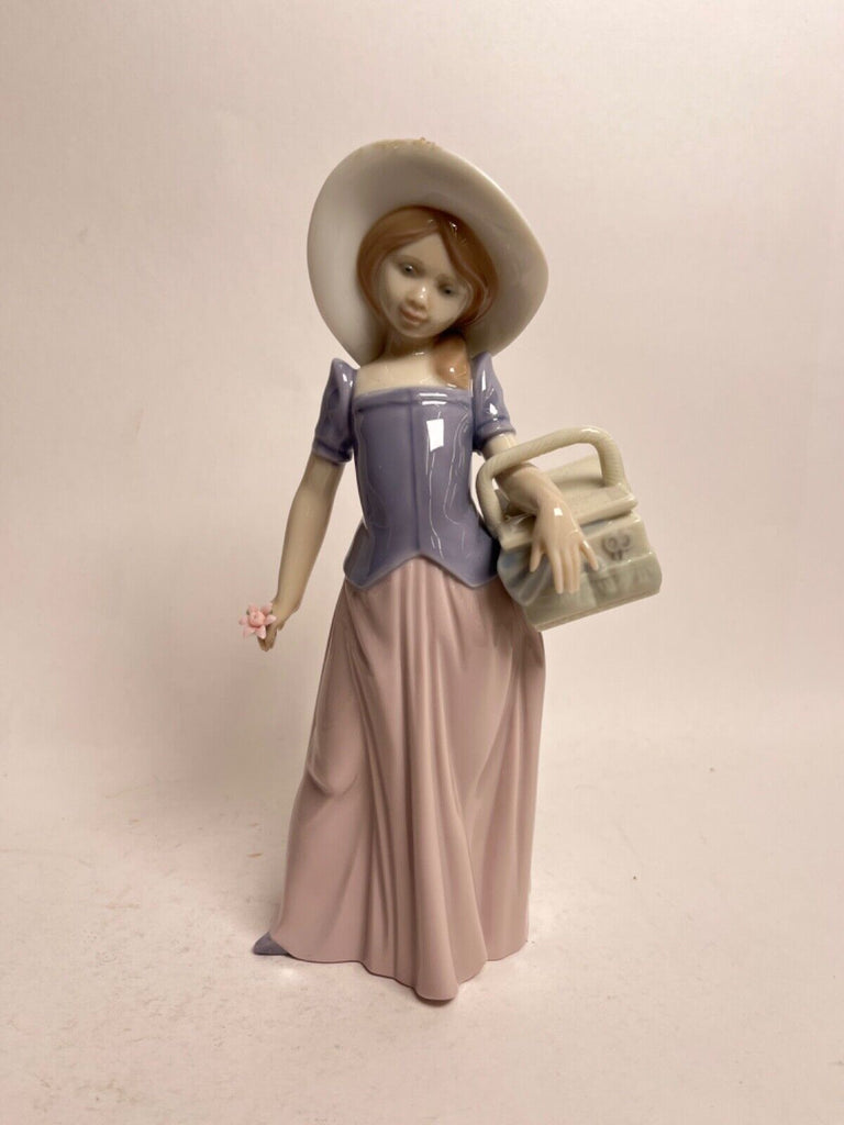 Lladro girl with hat porcelain figurine deals retired